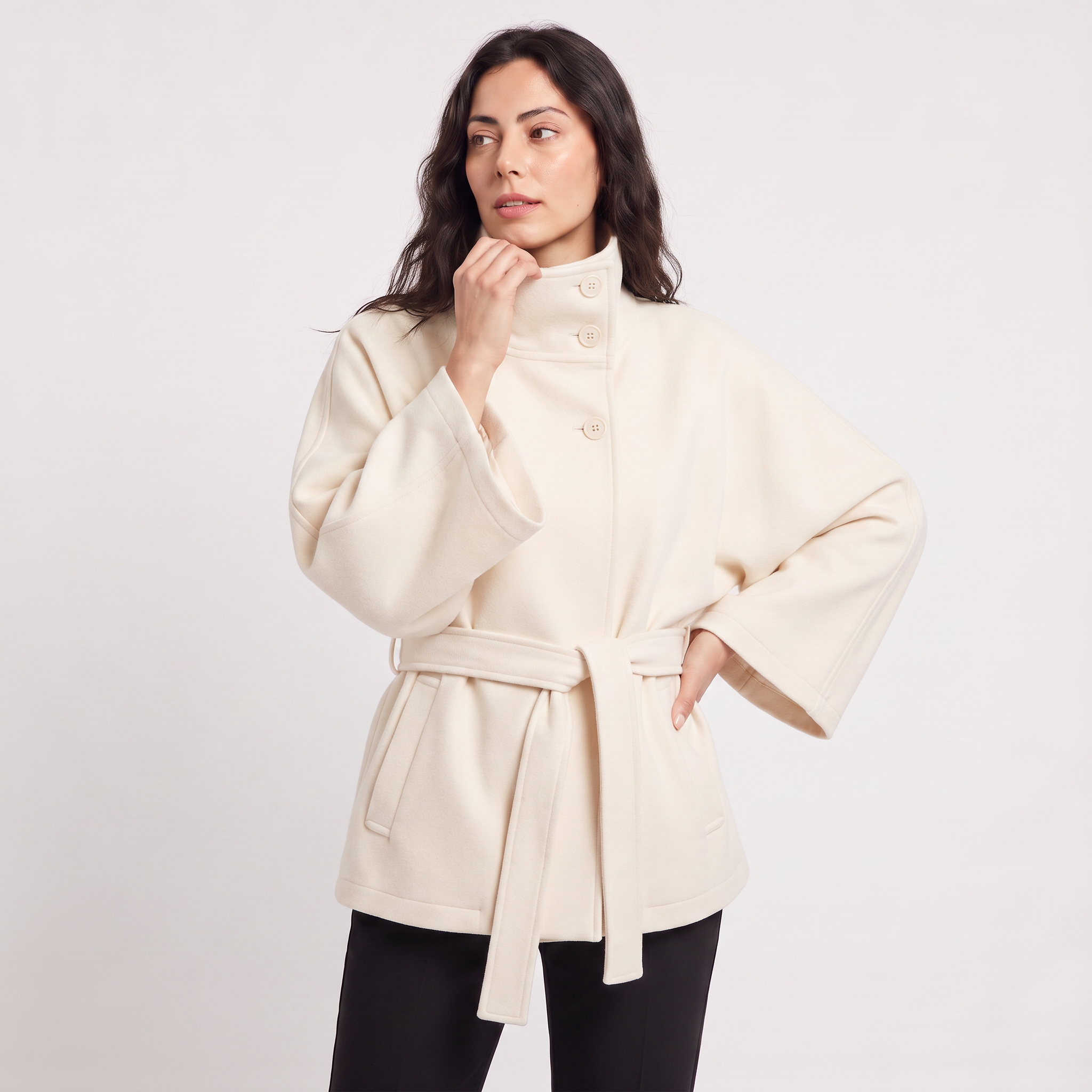 Women's oversized winter coat featuring a high collar and adjustable belt, designed for warmth and style, perfect for cold weather fashion. 6