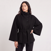 Women's oversized winter coat featuring a high collar and adjustable belt, designed for warmth and style, perfect for cold weather fashion. 7