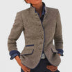 Women's black cardigan with button closure, designed for office wear, showcasing an elegant formal style suitable for professional settings. 0