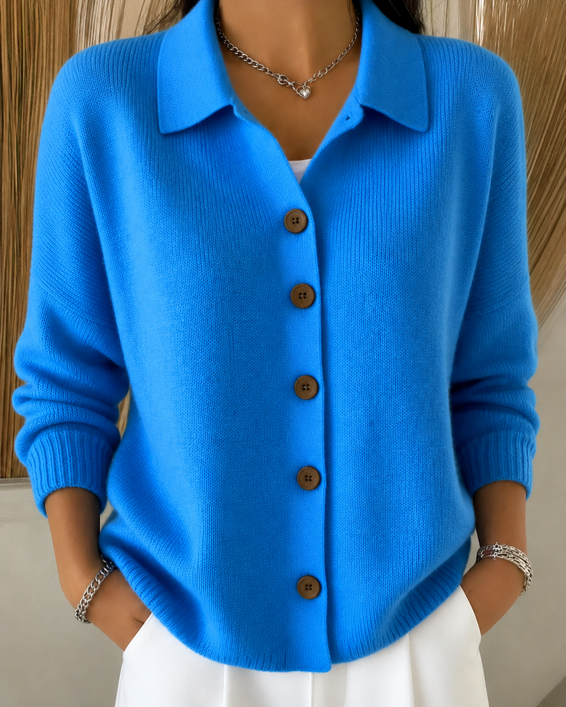 Women's white cardigan featuring a button collar and ribbed cuffs, crafted from soft knit fabric for a relaxed fit, perfect for layering in casual or semi-form 0