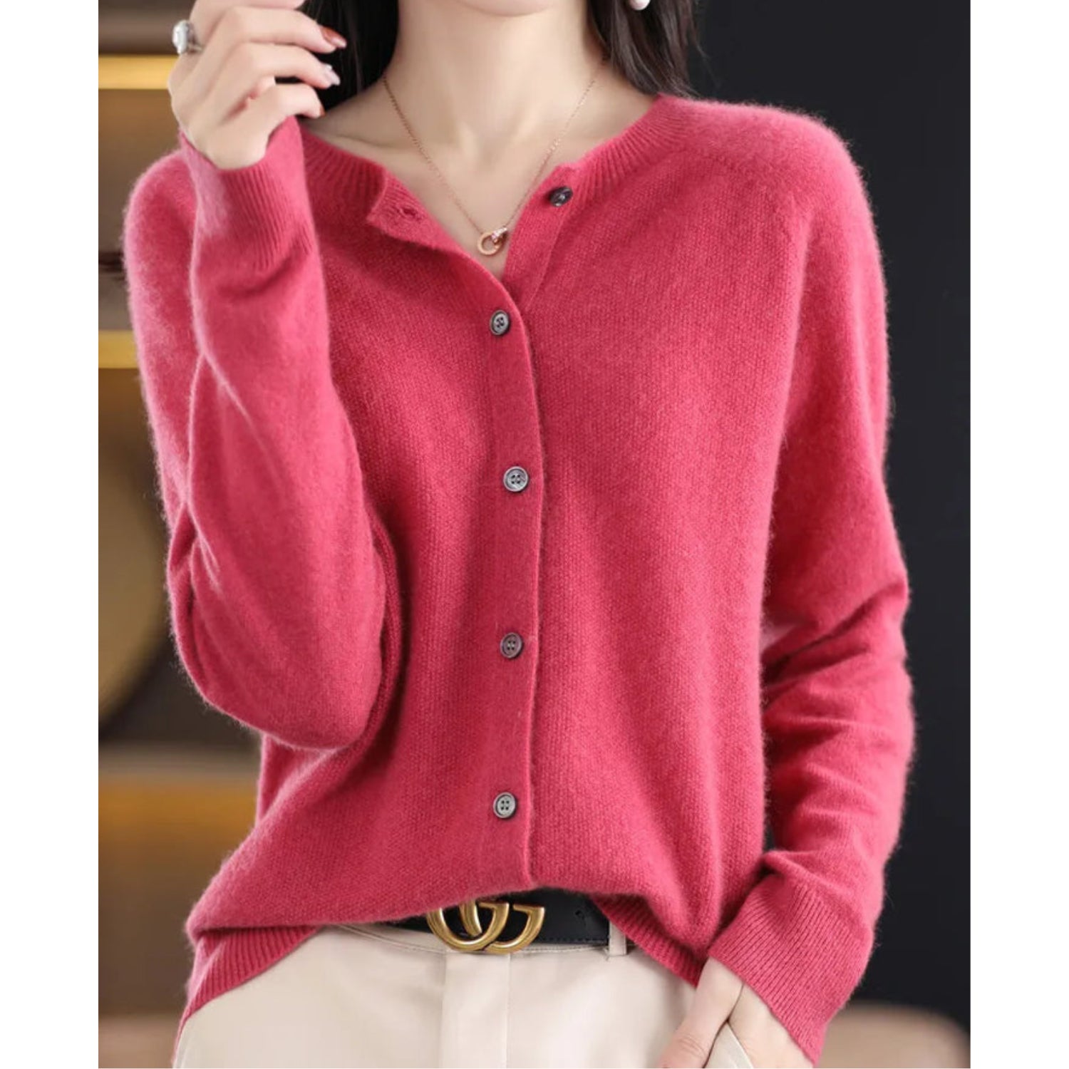 Women's black cardigan featuring a button front and relaxed fit, made from soft stretch knit fabric, perfect for layering and comfortable wear. 1
