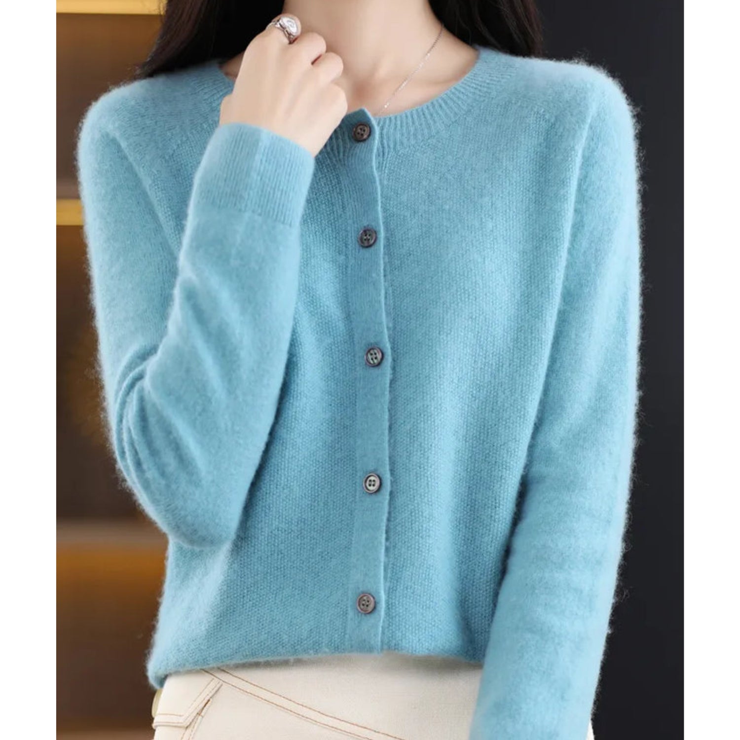 Women's black cardigan featuring a button front and relaxed fit, made from soft stretch knit fabric, perfect for layering and comfortable wear. 10