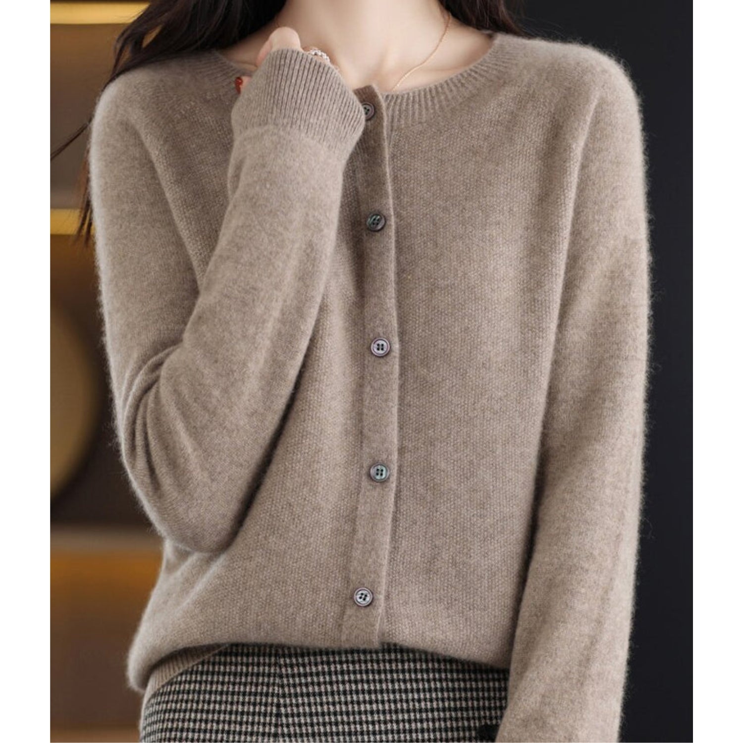 Women's black cardigan featuring a button front and relaxed fit, made from soft stretch knit fabric, perfect for layering and comfortable wear. 13