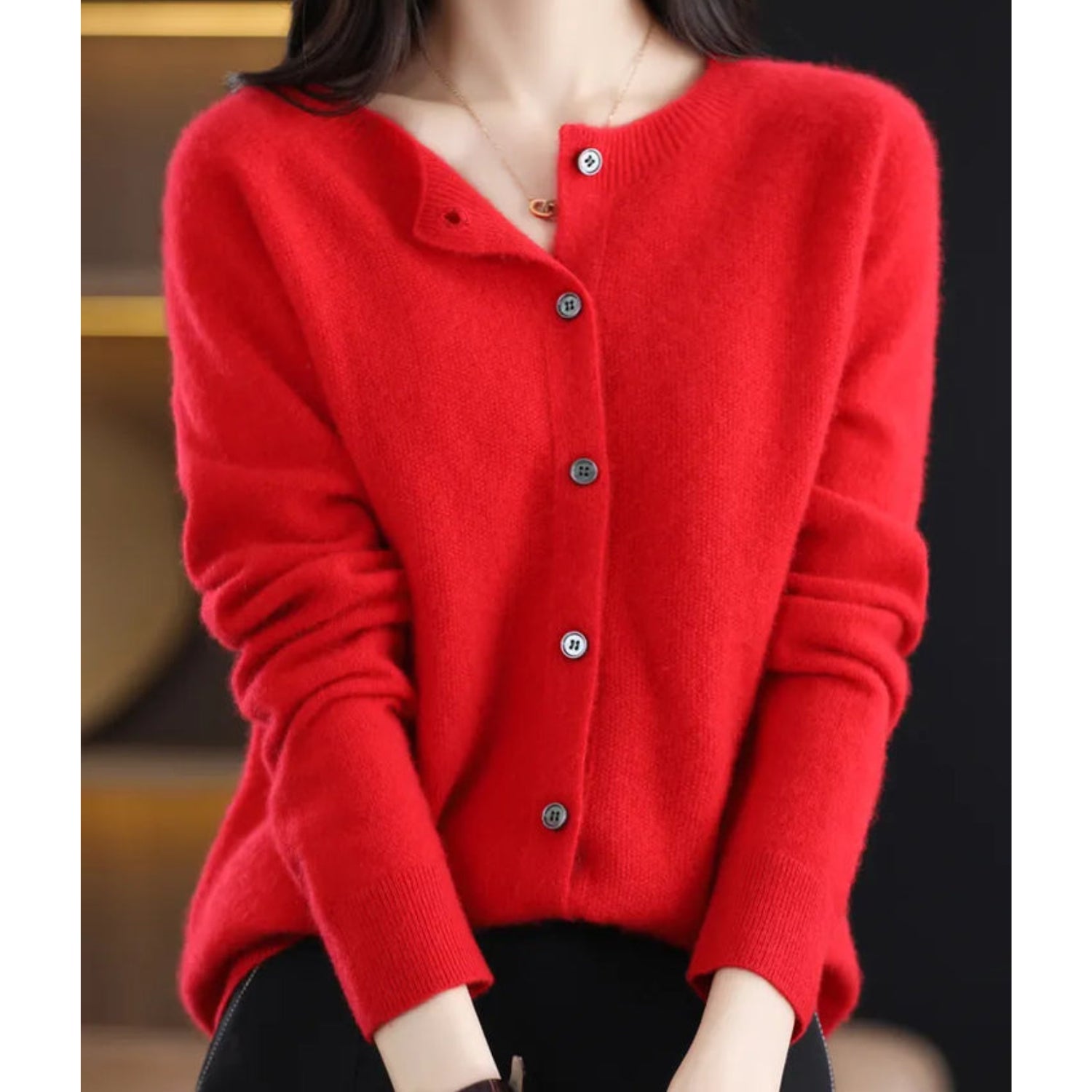 Women's black cardigan featuring a button front and relaxed fit, made from soft stretch knit fabric, perfect for layering and comfortable wear. 2
