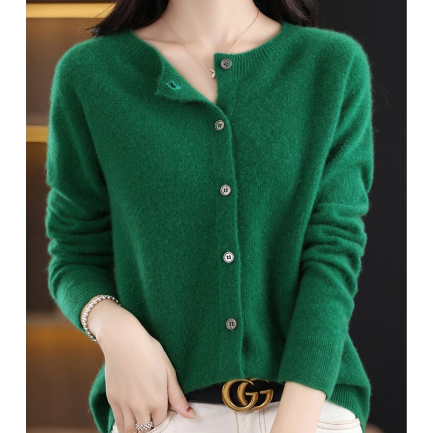 Women's black cardigan featuring a button front and relaxed fit, made from soft stretch knit fabric, perfect for layering and comfortable wear. 3
