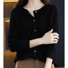 Women's black cardigan featuring a button front and relaxed fit, made from soft stretch knit fabric, perfect for layering and comfortable wear. 4