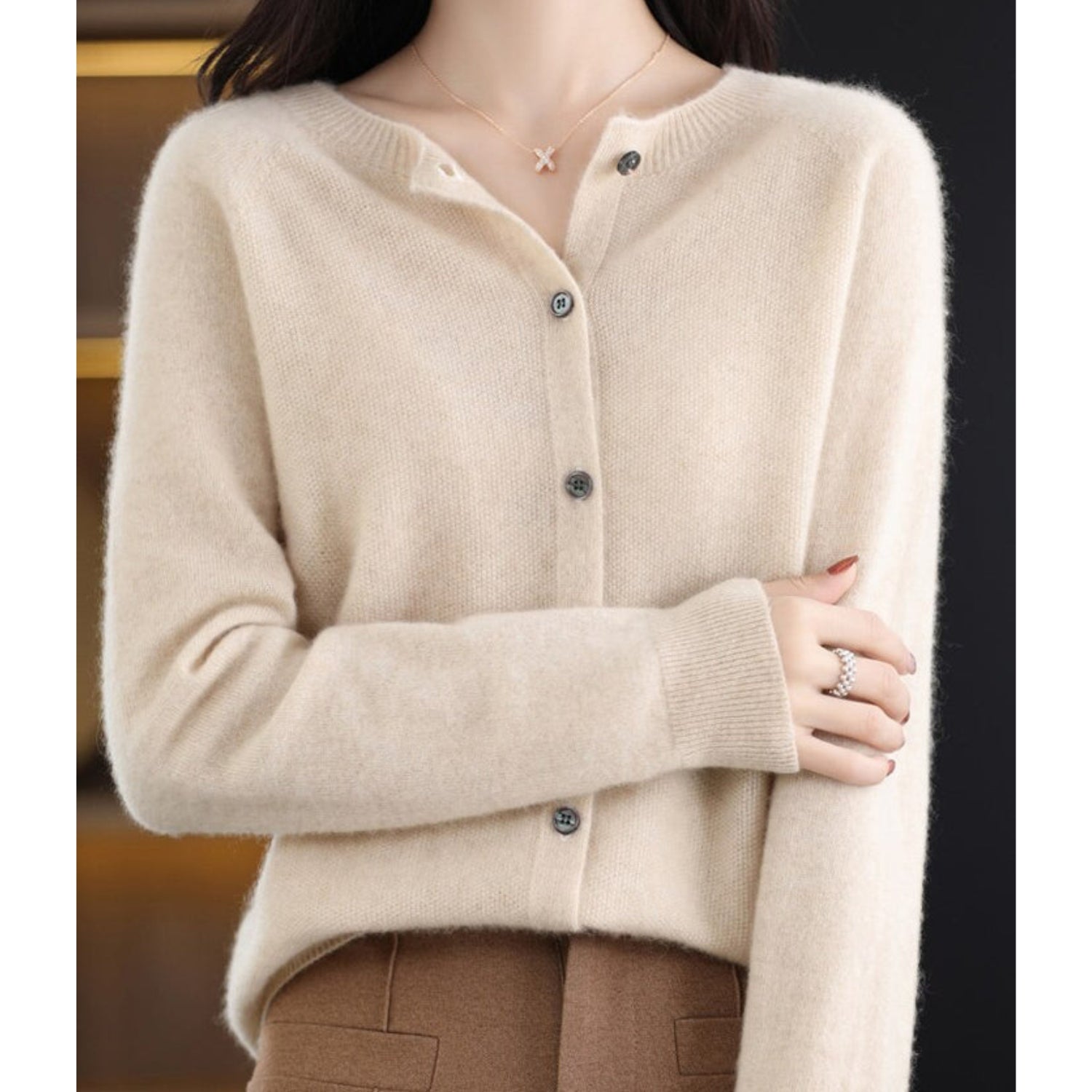 Women's black cardigan featuring a button front and relaxed fit, made from soft stretch knit fabric, perfect for layering and comfortable wear. 6