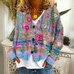 Women's cardigan featuring intricate floral embroidery, button-front design, and long sleeves in a soft knit fabric, ideal for a boho style look. 0