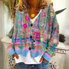 Women's cardigan featuring intricate floral embroidery, button-front design, and long sleeves in a soft knit fabric, ideal for a boho style look. 0