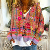 Women's cardigan featuring intricate floral embroidery, button-front design, and long sleeves in a soft knit fabric, ideal for a boho style look. 2