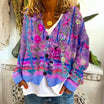 Women's cardigan featuring intricate floral embroidery, button-front design, and long sleeves in a soft knit fabric, ideal for a boho style look. 3