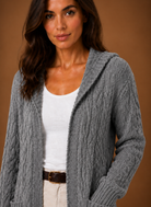 Women's black cardigan with hood and deep pockets, featuring a chunky cable knit design and mid-long duster length, perfect for layering in cooler weather. 4