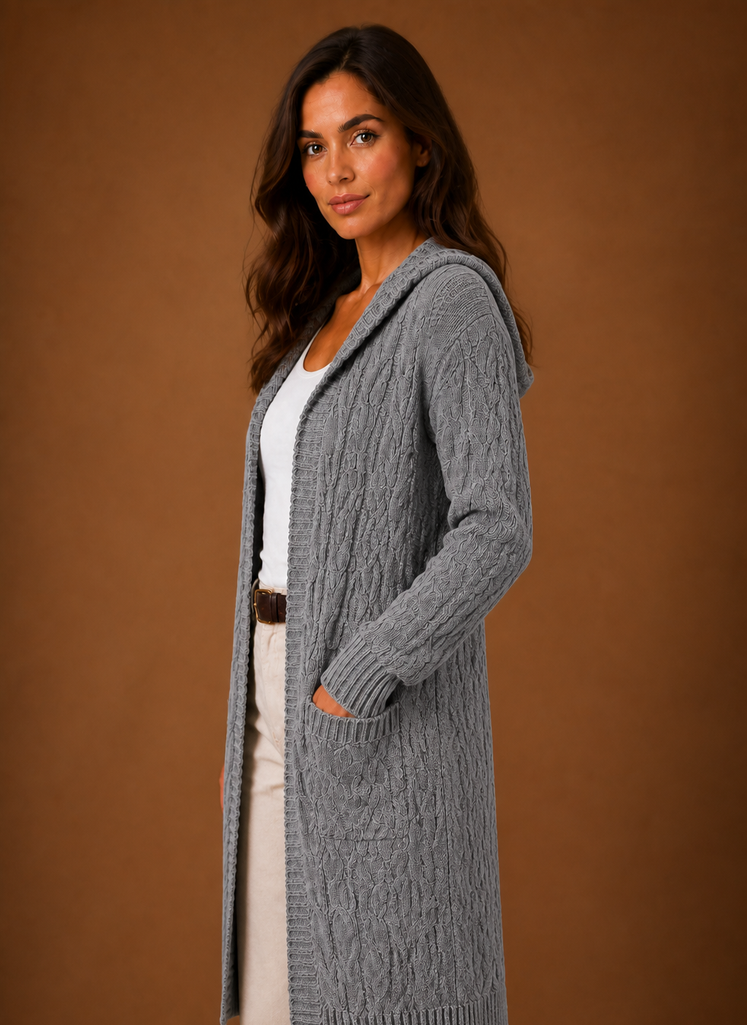 Women's black cardigan with hood and deep pockets, featuring a chunky cable knit design and mid-long duster length, perfect for layering in cooler weather. 6