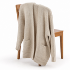 Women's chunky knit cardigan featuring an open front design, crafted from a soft wool-blend in oatmeal cream, designed for a relaxed fit. 4