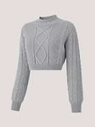 Women's cropped cable knit jumper featuring a mock neck and blouson sleeves, designed with a chunky knit for a cozy and stylish look. 2