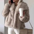Women's cropped faux fur jacket with open front, featuring a plush textured design perfect for autumn and winter styling. 1