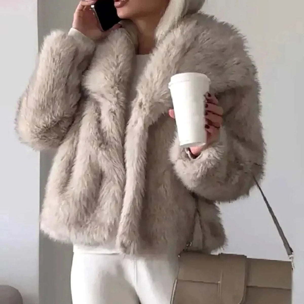 Women's cropped faux fur jacket with open front, featuring a plush textured design perfect for autumn and winter styling. 1