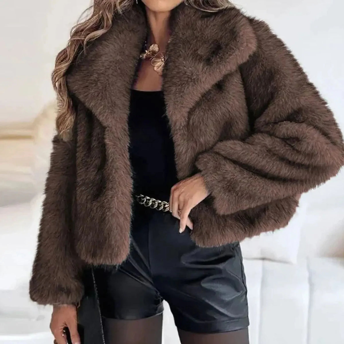Women's cropped faux fur jacket with open front, featuring a plush textured design perfect for autumn and winter styling. 2