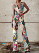 Women's denim jumpsuit featuring a floral print and wide-leg design, designed with a sleeveless V-neck for a stylish casual look. 0