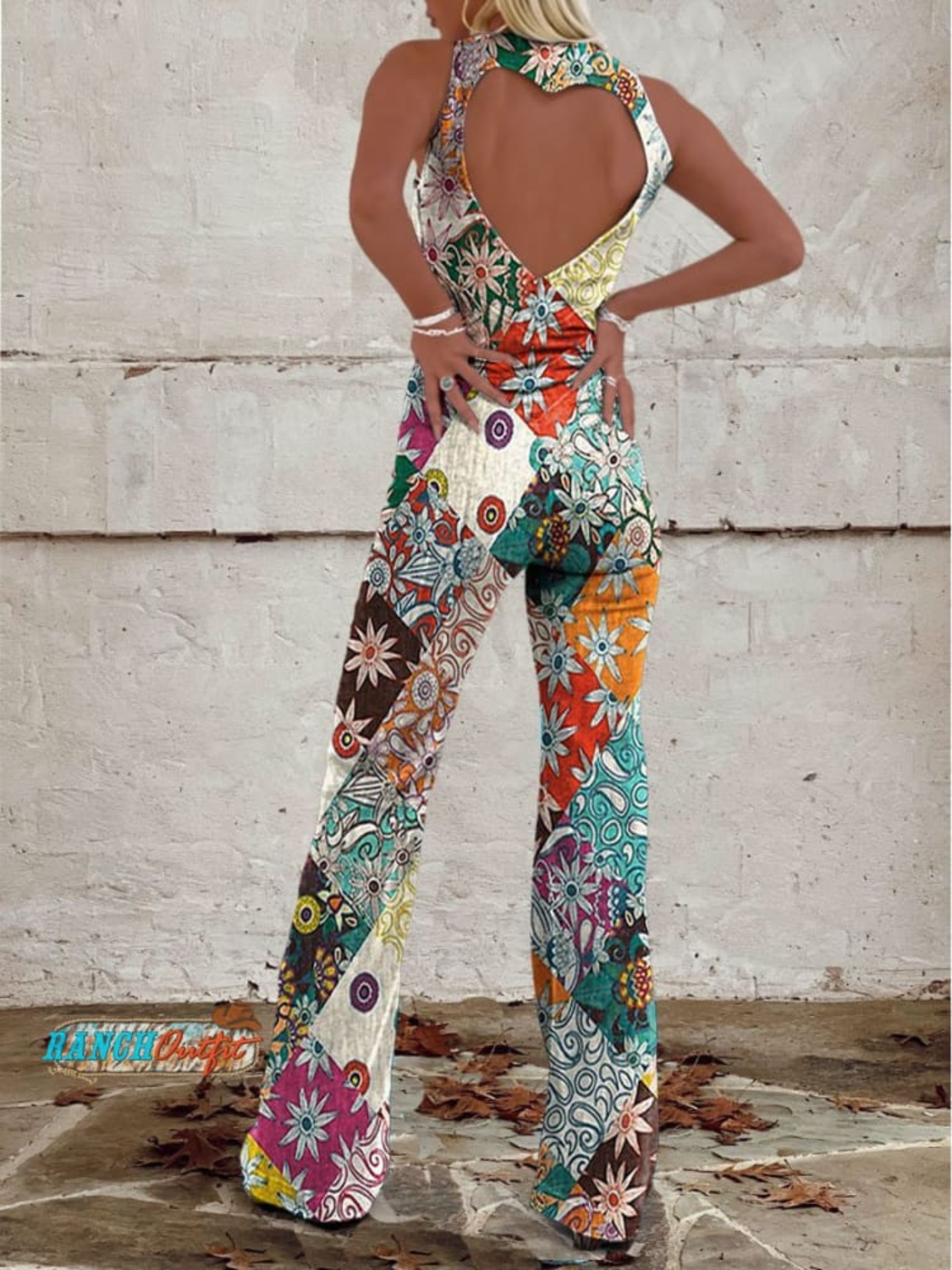 Women's denim jumpsuit featuring a floral print and wide-leg design, designed with a sleeveless V-neck for a stylish casual look. 1