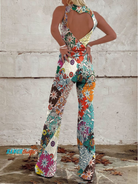 Women's denim jumpsuit featuring a floral print and wide-leg design, designed with a sleeveless V-neck for a stylish casual look. 1