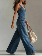 Women's denim jumpsuit featuring a V-neckline and wide-leg pants, elegantly designed in classic blue with a stylish sleeveless cut. 3
