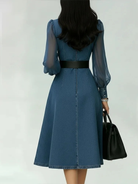 Women's denim midi dress featuring a belted waist and long sleeves, designed with an elegant V-neck in a stylish blue color, available in plus sizes. 1