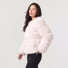 Women's faux fur jacket featuring a concealed fastening, designed for a relaxed fit and hip-length styling, perfect for fashionable layering in cool weather. 3