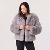 Women's faux fur jacket featuring a concealed fastening, designed for a relaxed fit and hip-length styling, perfect for fashionable layering in cool weather. 7
