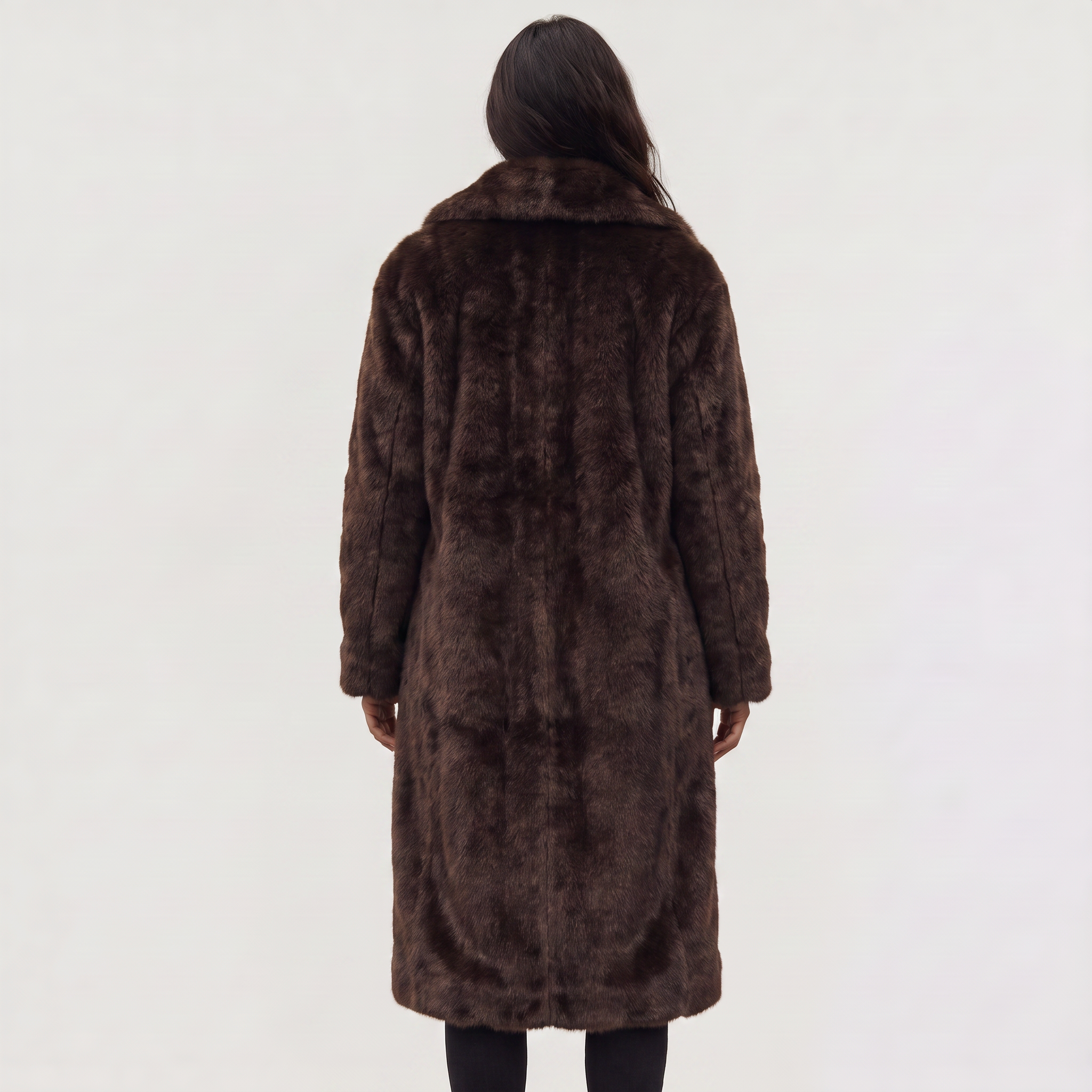 Women's faux fur trench coat featuring double-button fastening, side pockets, and a long relaxed fit, perfect for stylish winter outerwear. 5