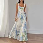 Women's floral maxi dress featuring a pleated skirt and square neckline, perfect for elegant summer events and weddings. 0