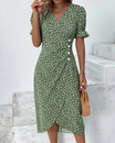 Women's floral midi dress featuring a wrap silhouette and V-neckline, perfect for summer wear; lightweight and comfortable fabric ideal for warm weather outings. 0