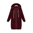 Women's longline cozy sweatshirt featuring an adjustable drawstring hood and front pockets, perfect for layering in cool weather. 11