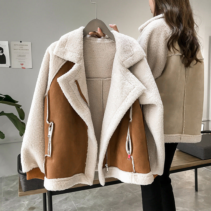 Women's oversized aviator winter coat in beige and brown featuring plush fleece lining and an asymmetric zip design, perfect for stylish warmth in colder months. 1
