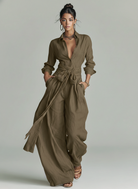 Women's jumpsuit featuring a stylish belt and shirt collar, crafted from a breathable cotton-linen blend, designed with long sleeves for versatility and comfort. 3