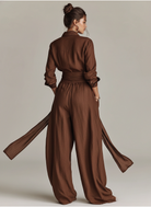Women's jumpsuit featuring a stylish belt and shirt collar, crafted from a breathable cotton-linen blend, designed with long sleeves for versatility and comfort. 5