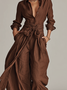 Women's jumpsuit featuring a stylish belt and shirt collar, crafted from a breathable cotton-linen blend, designed with long sleeves for versatility and comfort. 6