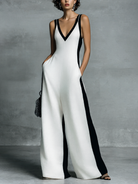 Women's black and white patchwork cotton linen jumpsuit featuring a wide-leg fit and deep V-neck design, perfect for casual or chic occasions. 0