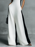 Women's black and white patchwork cotton linen jumpsuit featuring a wide-leg fit and deep V-neck design, perfect for casual or chic occasions. 3