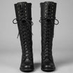 Women's black faux leather knee-high boots featuring a lace-up front, block heel, and stylish stud detail. 0