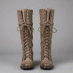 Women's black faux leather knee-high boots featuring a lace-up front, block heel, and stylish stud detail. 7