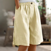 Women's linen blend shorts featuring an elastic waistband, designed for lightweight comfort and casual summer wear, complete with convenient pockets. 2