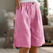 Women's linen blend shorts featuring an elastic waistband, designed for lightweight comfort and casual summer wear, complete with convenient pockets. 4