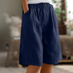 Women's linen blend shorts featuring an elastic waistband, designed for lightweight comfort and casual summer wear, complete with convenient pockets. 5