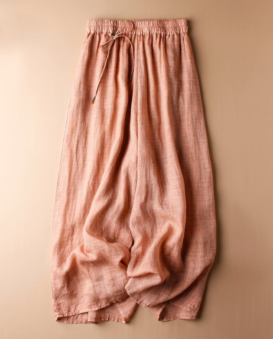 Women's linen pants featuring an elastic waistband and a relaxed wide leg design, perfect for comfortable casual wear. 1