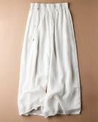 Women's linen pants featuring an elastic waistband and a relaxed wide leg design, perfect for comfortable casual wear. 2