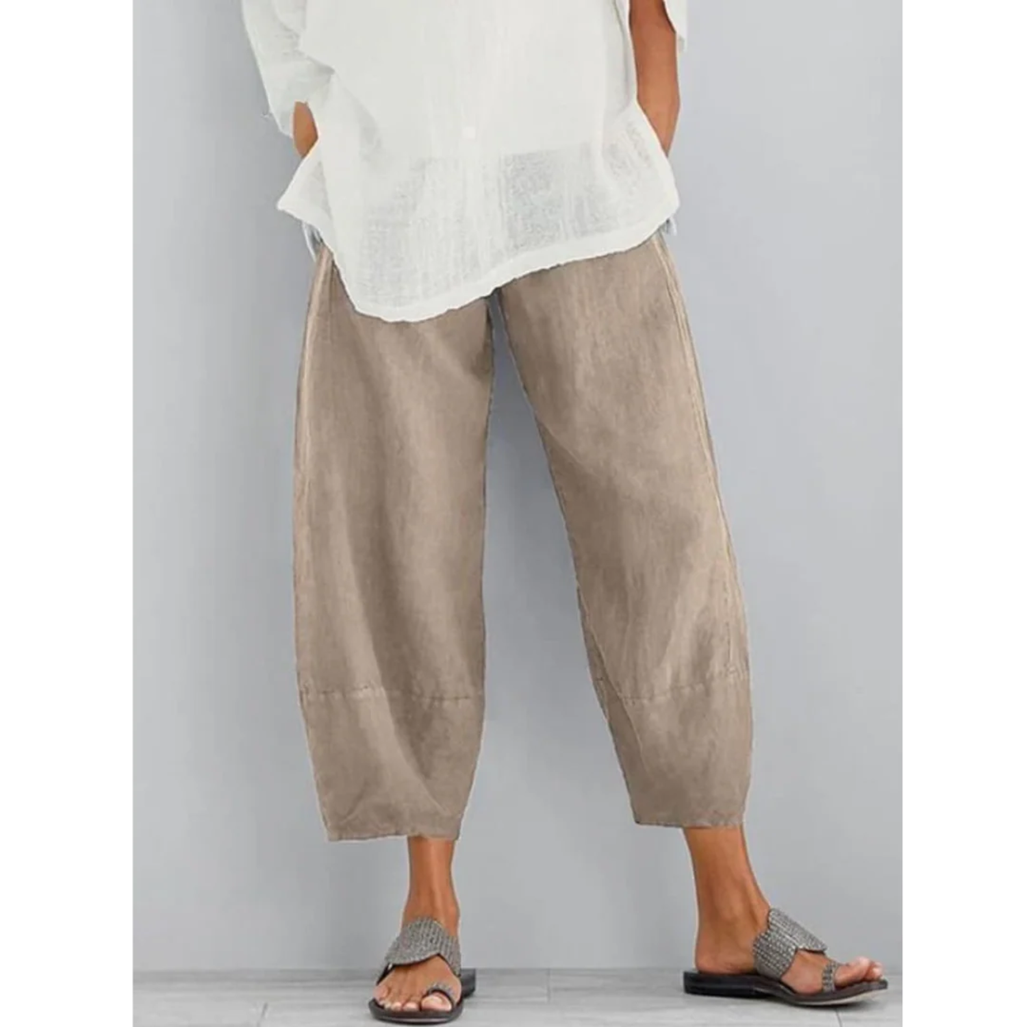 Women's lightweight casual white linen pants featuring an elastic waistband, perfect for summer leisure and comfort. 0