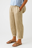 Women's linen pants featuring an elastic waistband and tapered design, perfect for casual wear; breathable and lightweight fabric ideal for warm weather. 0
