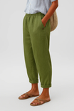 Women's linen pants featuring an elastic waistband and tapered design, perfect for casual wear; breathable and lightweight fabric ideal for warm weather. 1