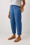 Women's linen pants featuring an elastic waistband and tapered design, perfect for casual wear; breathable and lightweight fabric ideal for warm weather. 2